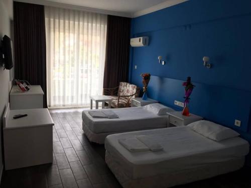 Postel nebo postele na pokoji v ubytování Hancı apart