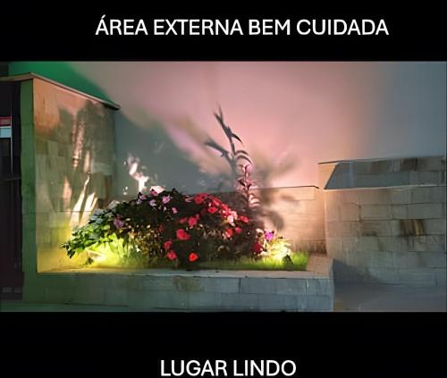 a picture of a flower planter in a building at Laguna Lofts in Poços de Caldas