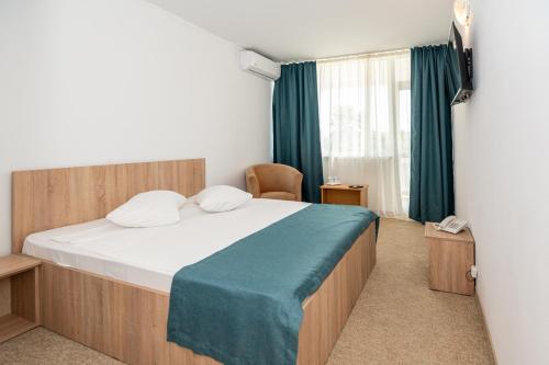 Postel nebo postele na pokoji v ubytování Hotel Semiramis