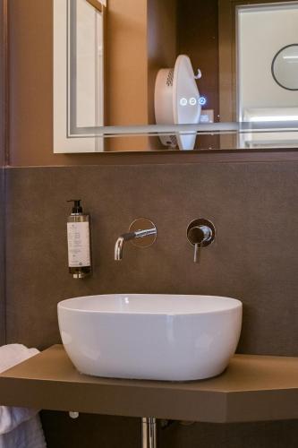 a bathroom with a white sink and a mirror at 163 BOUTIQUE HOTEL in Rome