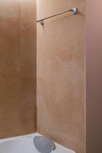 a shower stall with a toilet in a bathroom at 163 BOUTIQUE HOTEL in Rome