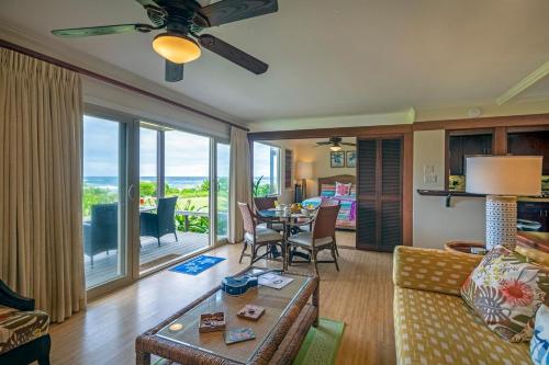 a living room with a couch and a table at Hanalei Colony Resort I-2 in Hanalei