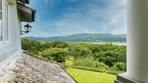 a window of a house with a view of a field at Hafod Cae Maen in Penrhyndeudreath