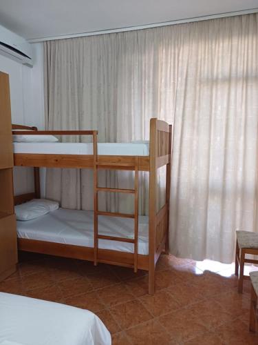 Postel nebo postele na pokoji v ubytování Arben