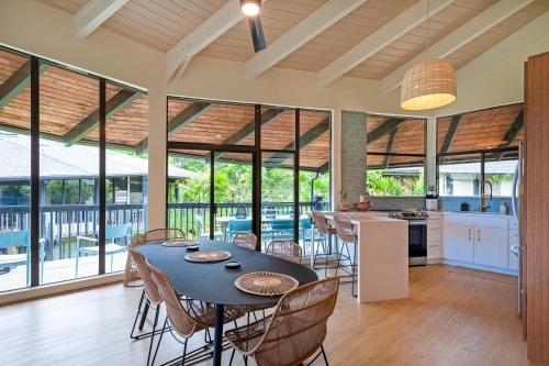 an open kitchen and dining room with a table and chairs at Mauna Kai 5B in Princeville