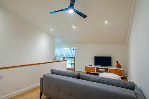a living room with a couch and a ceiling fan at Mauna Kai 5B in Princeville