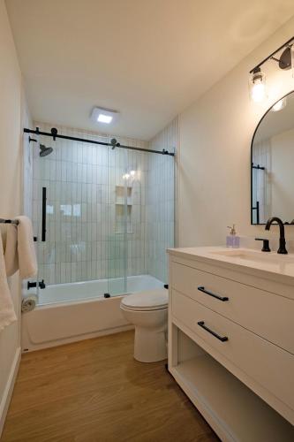 a bathroom with a toilet and a sink and a shower at Mauna Kai 5B in Princeville