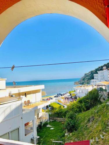 a view of a beach and the ocean from a building at Karadag in Ulcinj