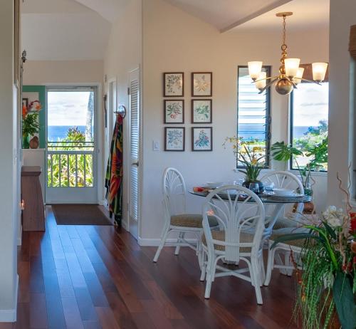 a dining room with a table and chairs at Hanalei Bay Villa 26 in Princeville