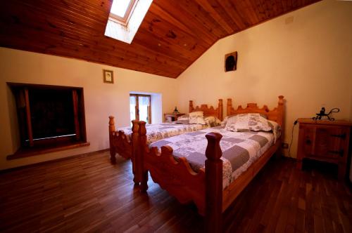 a bedroom with a large wooden bed in a room at Ferrata Vacanze in Rhêmes-Notre-Dame