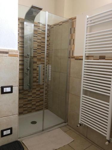 a shower with a glass door in a bathroom at Sardegna Sud Orientale, Villaputzu, appartamento in centro in Villaputzu