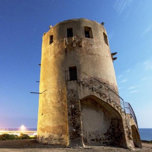 an old lighthouse sitting on top of the beach at Sardegna Sud Orientale, Villaputzu, appartamento in centro in Villaputzu