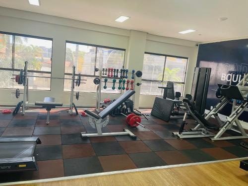 a gym with lots of equipment in a room at Hotel boulevard caldas novas in Caldas Novas
