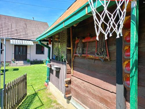 a house with a basketball hoop on the side of it at Pantića avlija - Ethno household in Požega