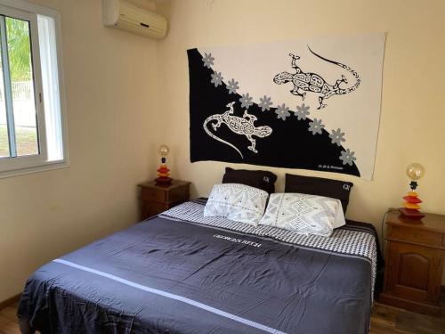 Ένα ή περισσότερα κρεβάτια σε δωμάτιο στο L'Oasis