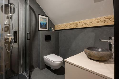 a bathroom with a sink and a toilet at MiLove in Milówka