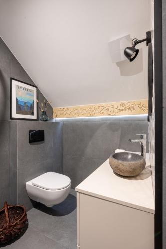 a bathroom with a sink and a toilet at MiLove in Milówka