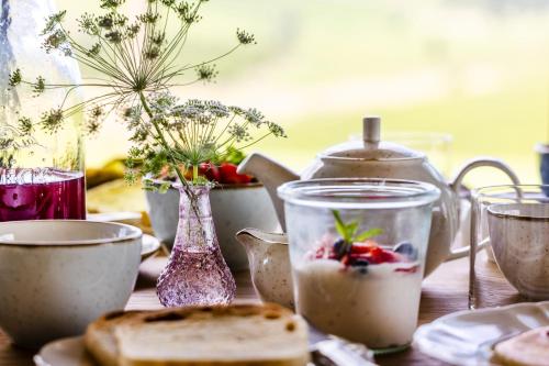 a table with a bowl of food and a bowl of fruit at Colle Alberti Country House in Cerreto Guidi
