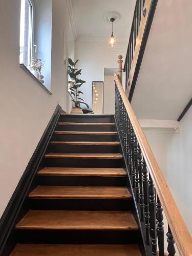 a staircase in a house with wooden steps at Modern Stay I Cosy & Central Apartments in Koblenz