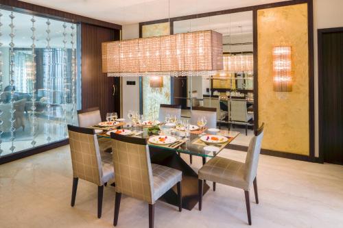 a dining room with a table and chairs at Mandarin Oriental Al Faisaliah, Riyadh in Riyadh