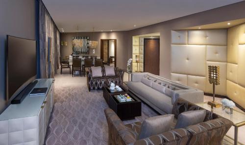 a living room with a couch and a table at Mandarin Oriental Al Faisaliah, Riyadh in Riyadh