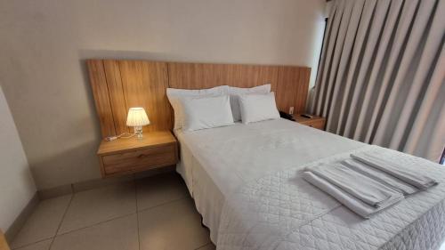 a bedroom with a bed with towels on it at Italian Palace Hotel in Sinop