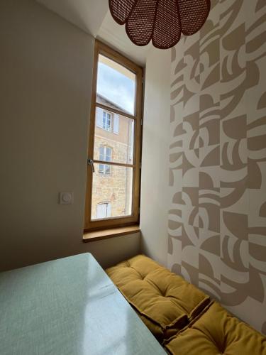 Postel nebo postele na pokoji v ubytování Appartement Champollion 2
