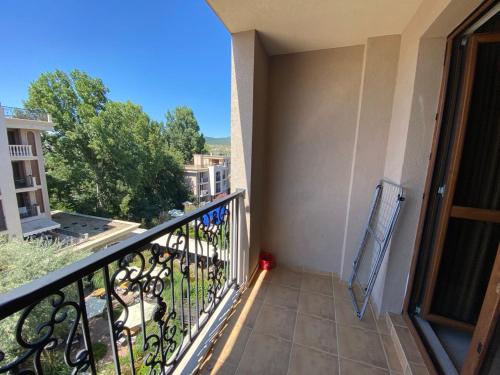 a balcony with a view of a building at КАСКАДАС Луксозни нови студия in Sunny Beach