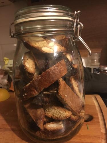 a glass jar filled with cookies on a table at Villa Orsini - A Retreat in Pisa - Food and Relax in Pisa