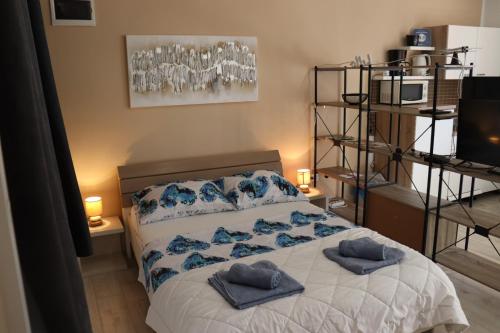 Postel nebo postele na pokoji v ubytování Apartments Matelici