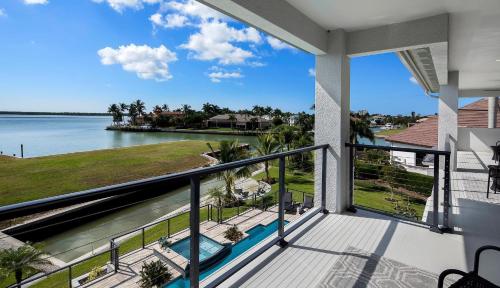 a balcony with a view of the water at Addison Opulence in Marco Island