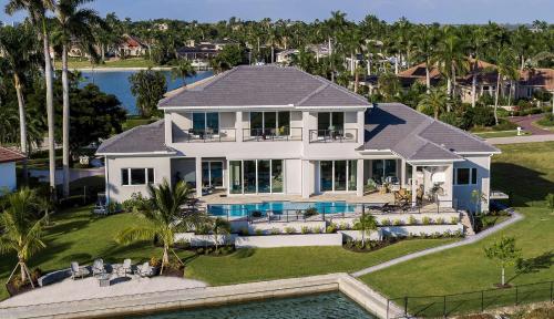 an aerial view of a house with a swimming pool at Addison Opulence in Marco Island