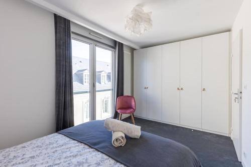 Ένα ή περισσότερα κρεβάτια σε δωμάτιο στο Appartement Hyper Centre Parking Privée
