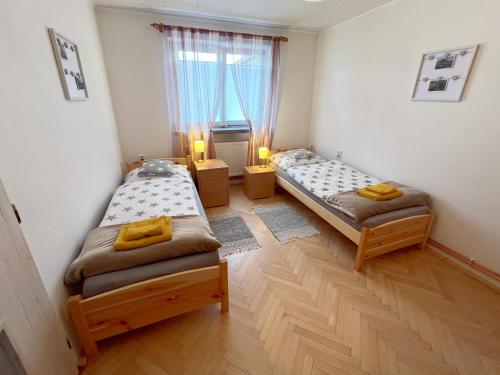 Postel nebo postele na pokoji v ubytování Apartmán U Jiroutů
