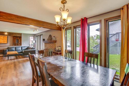 a dining room and living room with a table and chairs at Near Downtown and Fishing Anchorage Escape! in Anchorage