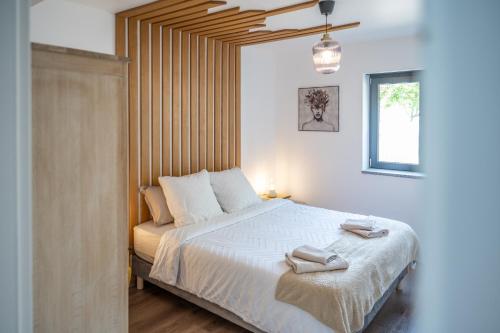 Ένα ή περισσότερα κρεβάτια σε δωμάτιο στο Appartement l'Eden