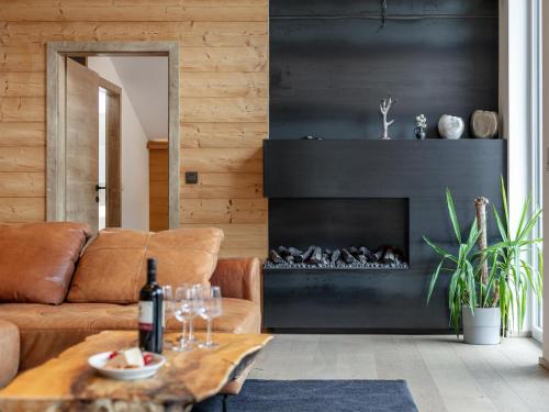 a living room with a couch and a fireplace at Apart33 Top 1-33 Penthouse in Haus im Ennstal