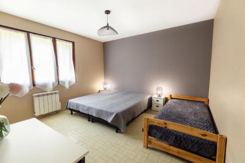 Postel nebo postele na pokoji v ubytování Villa-des-eaux Douces