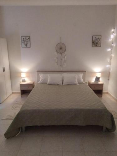 Ένα ή περισσότερα κρεβάτια σε δωμάτιο στο Apartman Golubinka - Molat