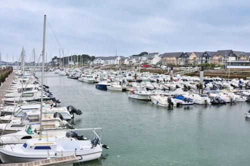 a bunch of boats are docked in a marina at Maison des dunes in Erdeven