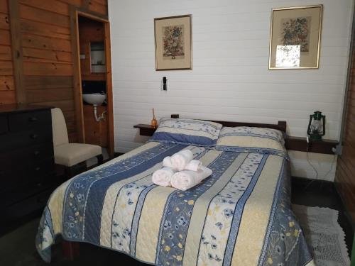 En eller flere senge i et værelse på Pousada Florada na Serra - Apto 6