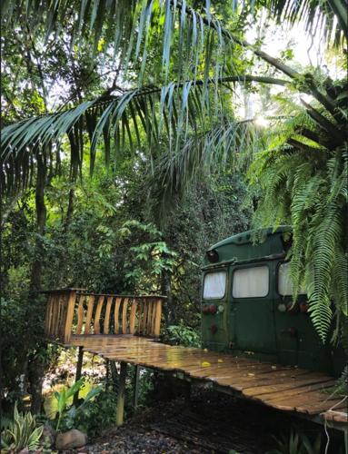 a green van parked next to a wooden bench at Cool Waters Jungle Villas in Uvita