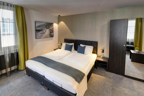 Katil atau katil-katil dalam bilik di Boutique Hotel Reiser