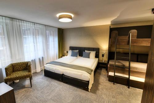 Katil atau katil-katil dalam bilik di Boutique Hotel Reiser