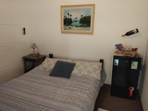 En eller flere senge i et værelse på Pousada Florada na Serra - Apto 7