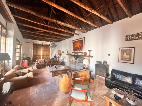 a large living room with couches and a fireplace at Casa lila Hotel in Sesquilé