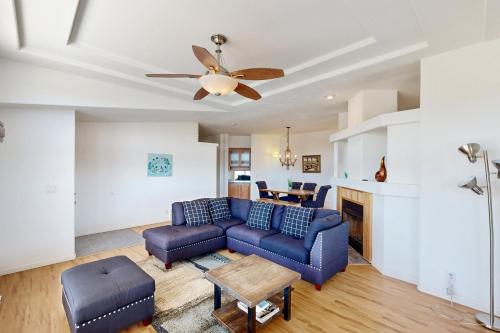 a living room with a couch and a ceiling fan at Nonpariel Escape in Paso Robles