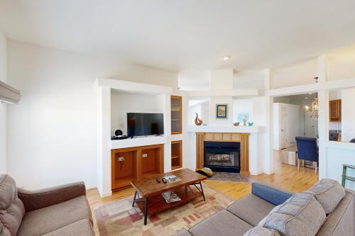 a living room with a couch and a fireplace at Nonpariel Escape in Paso Robles