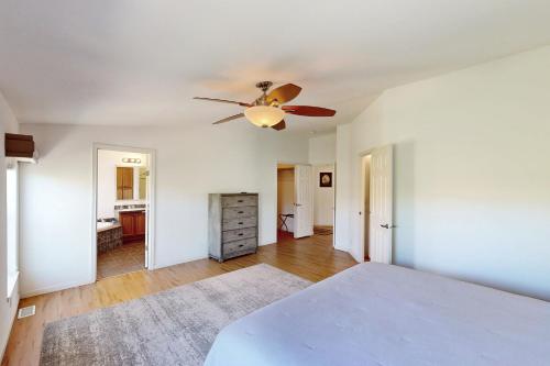 a bedroom with a bed and a ceiling fan at Nonpariel Escape in Paso Robles