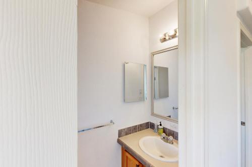 a bathroom with a sink and a mirror at Nonpariel Escape in Paso Robles